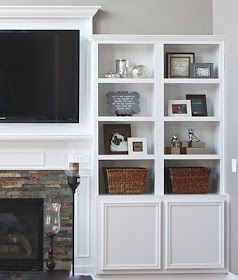 Frame around tv above fireplace and also the stone around the fireplace. No room for book cases.