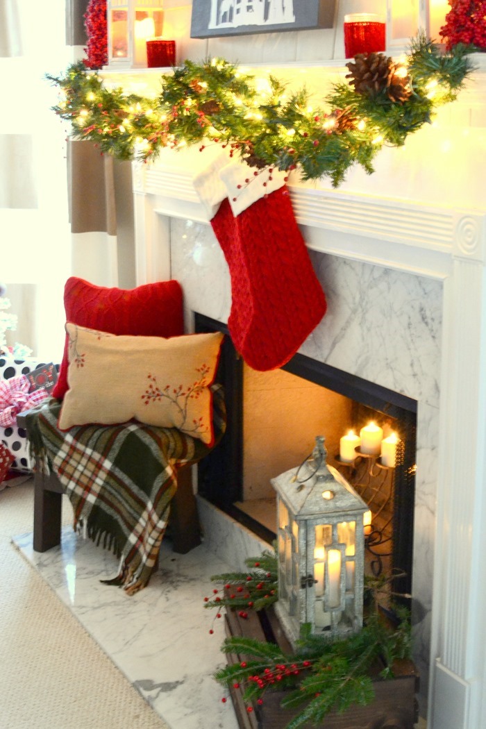Red and festive Christmas mantel with DIY lit canvas