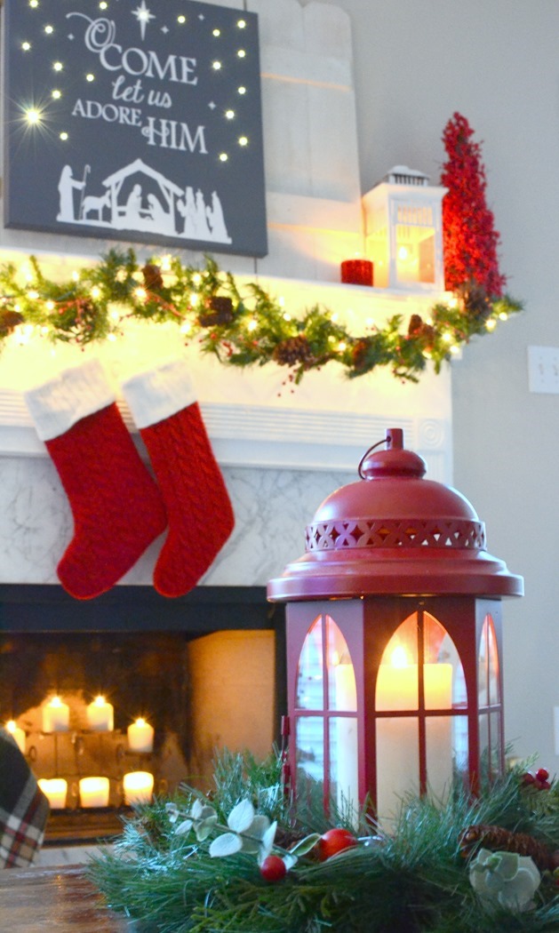 Red and festive Christmas mantel with DIY lit canvas