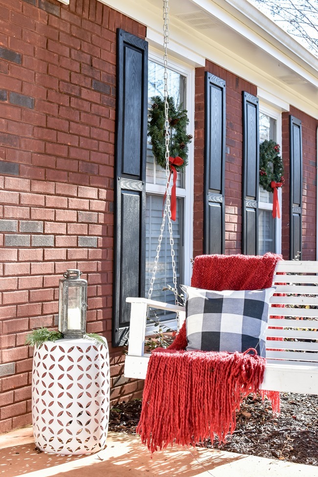 Farmhouse style Christmas front porch with picket fences-16