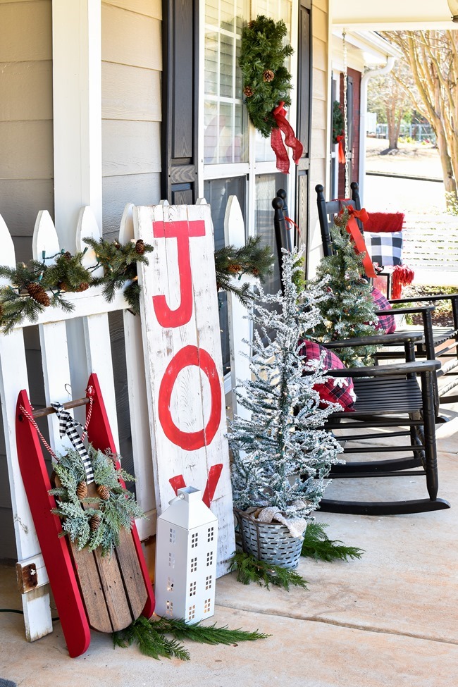 Farmhouse style Christmas front porch with picket fences-21