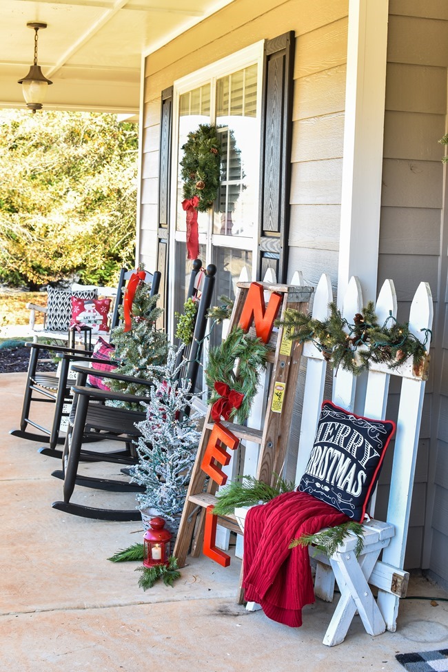 Farmhouse style Christmas front porch with picket fences-3
