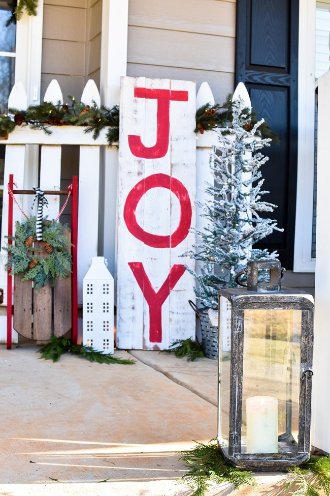 Farmhouse style Christmas front porch with picket fences-7